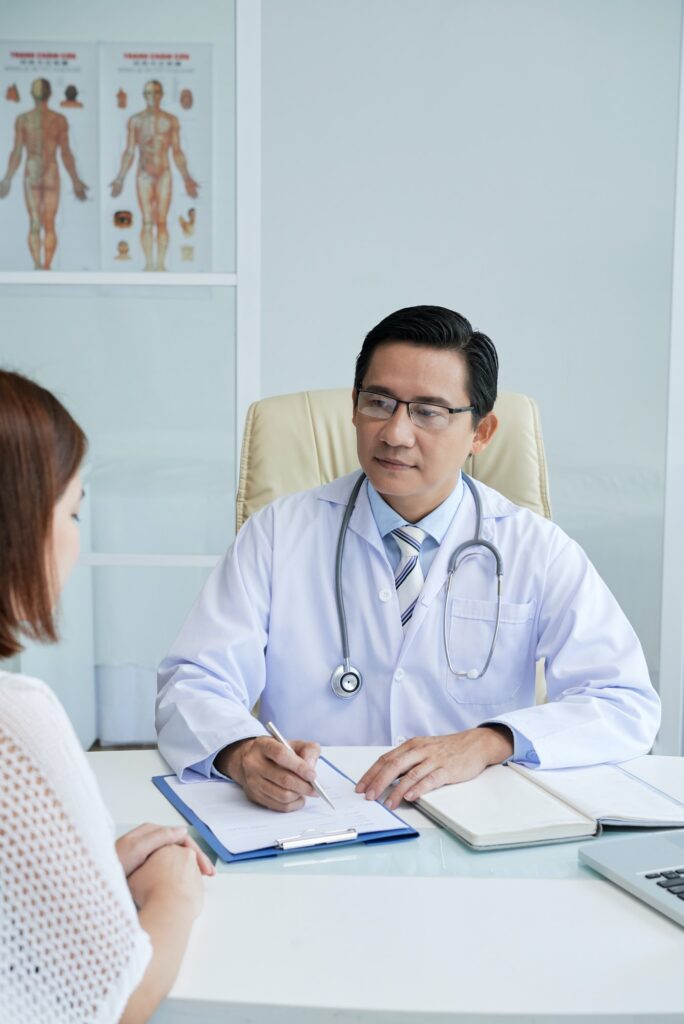 Doctor Listening to Female Patient